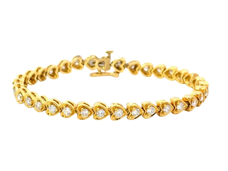 ladies-infinity-diamond-bracelets-18k Yellow Gold Diamond Heart Tennis Bracelet